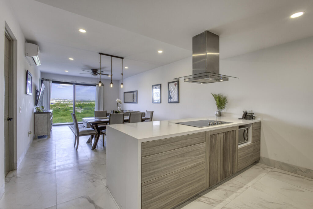 Los Cabos Amaterra 2BR/2BA oceanside condo in prime Cabo San Lucas location, less than a 5-minute walk to the beach. Bright, open-concept living and dining area with abundant natural light and access to private terrace. Modern kitchen with ample cabinetry and workspace. Spacious primary suite with en-suite bath; well-sized second bedroom with adjacent full bath. Ideal for vacation home, rental investment, or full-time residence. Close to beaches, restaurants, shopping, and downtown Cabo amenities. Condo unit comes with 2 underground parking stalls as well. – Amaterra, Cabo Corridor, Cabo Corridor, BS