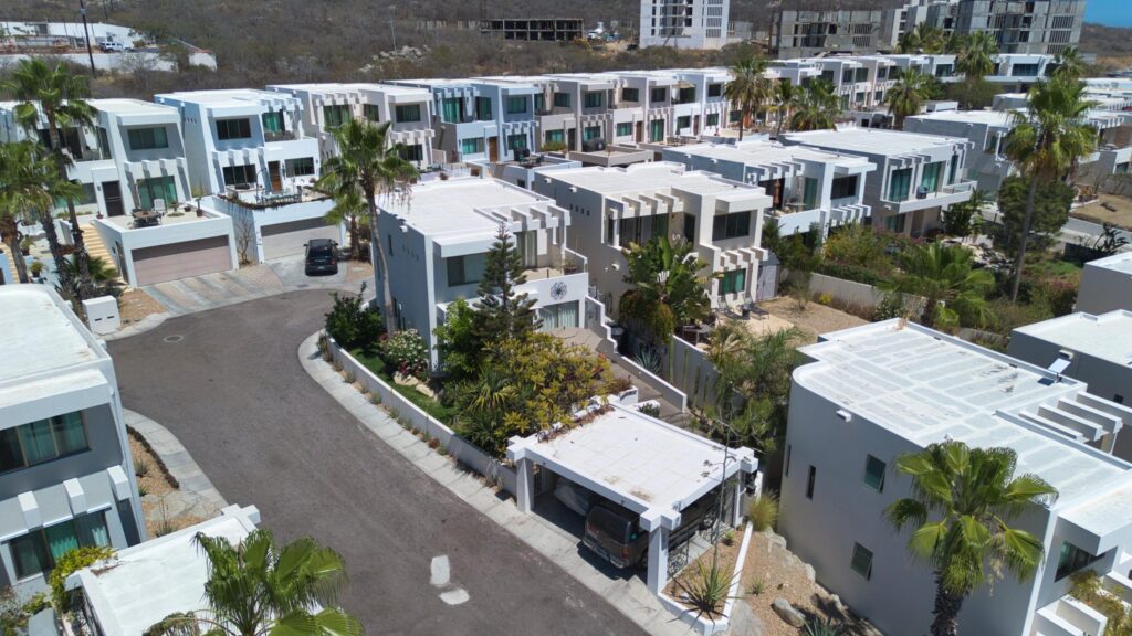 Los Cabos Cumbre Del Tezal Luxury finishes include marble flooring, wood kitchen with granite countertops, built-in wooden closets in all bedrooms, and vanities with tempered glass shower doors in all 3.5 baths. Fully equipped with 5 Gree inverter mini-split A/C units (3 × 1-ton, 2 × 2-ton), LG 22' French Door refrigerator, Whirlpool gas stove, and 1.7 cu ft microwave hood. Additional features: rooftop with bar, grill & sink, private terrace, storage, WiFi smart lock, private 5,000-liter cistern, and termite prevention system. Community: pool, gym, sports courts, kids' area, 3 clubhouses & 24/7 gated security – Casa Kate, Cabo Corridor, Cabo Corridor, BS