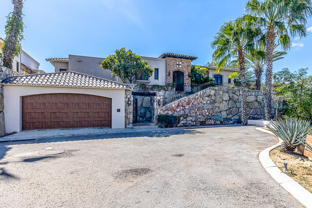 Los Cabos Hermitage Villa No. 1 features a street-level garage with space for two large vehicles. From the garage, a staircase leads up to the villa, where the entire residence is laid out on a single level.The villa offers four bedrooms and four bathrooms, although one of the bedrooms has been converted into a television room. It also includes a living room, dining room, kitchen, pantry, laundry room, service room with a full bathroom.The outdoor areas feature a covered terrace, garden, swimming pool, and jacuzzi. The villa is delivered fully furnished and equipped, including hurricane protection systems. for sale